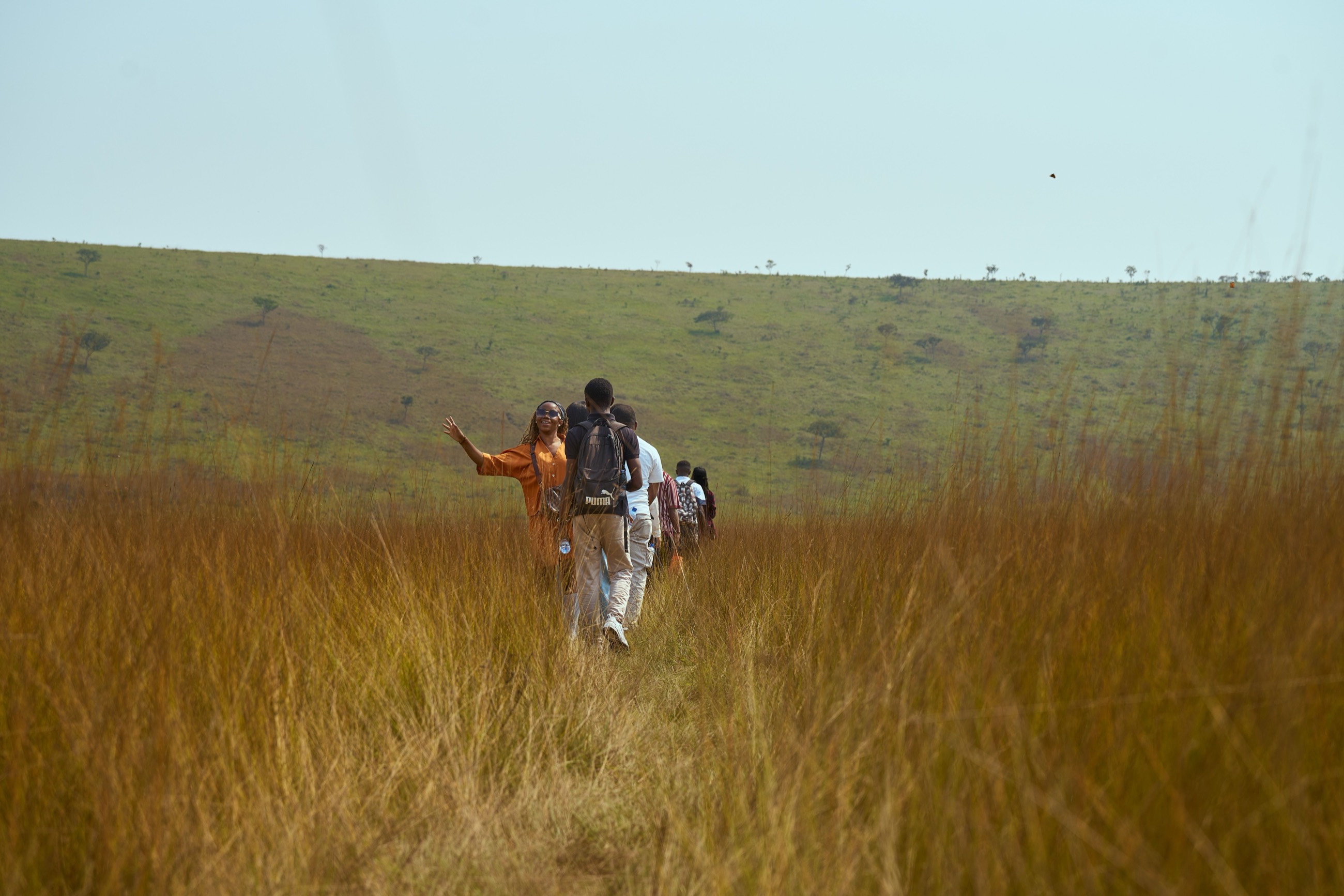 A guided walking safari through golden grassland