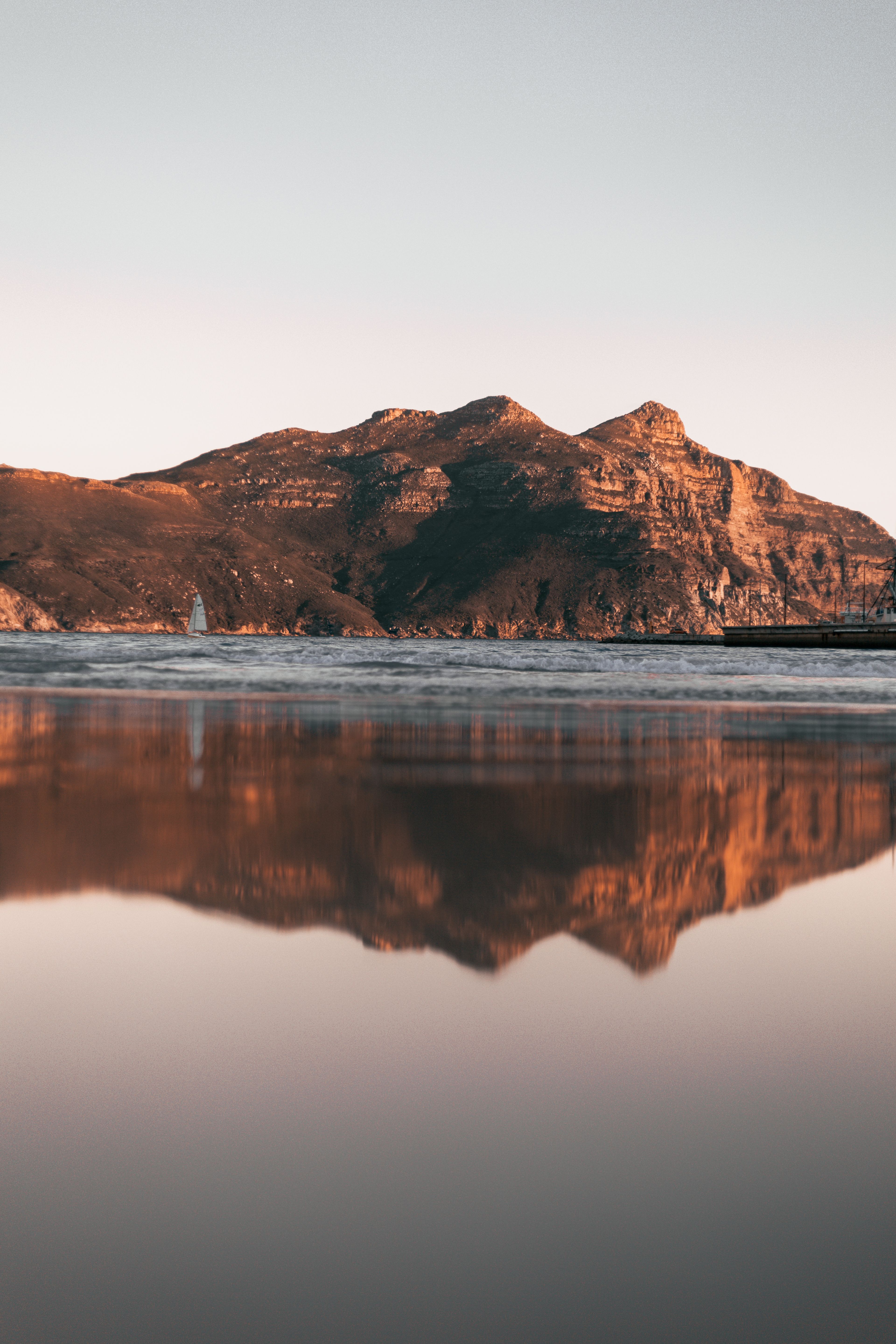 Still lagoon reflecting the mountains near Hermanus